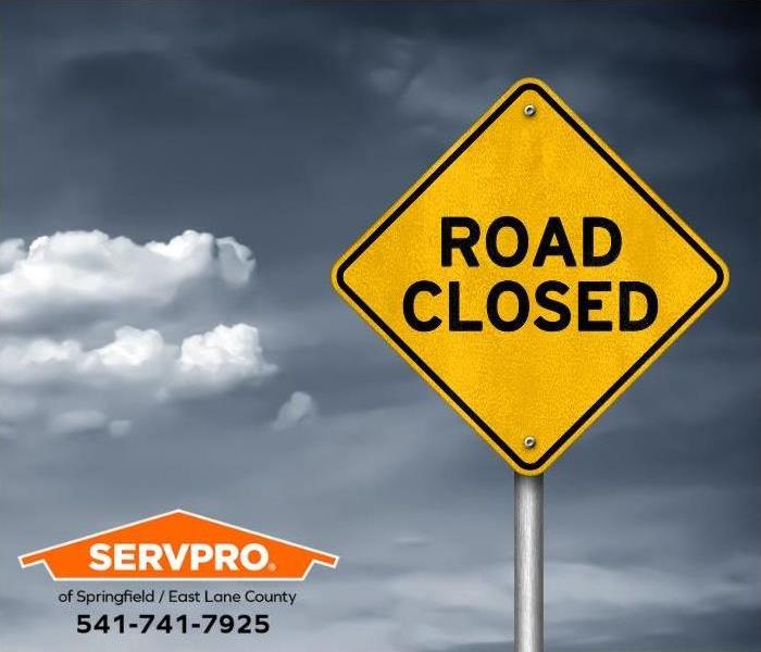 A road closed sign is shown.
