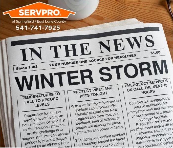 A newspaper warns of an approaching winter storm.